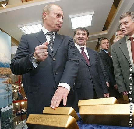 Putin fondling gold bars